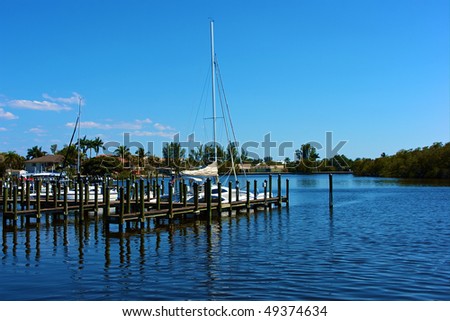 scenic view of boats at dock in canal in bonita springs, florida