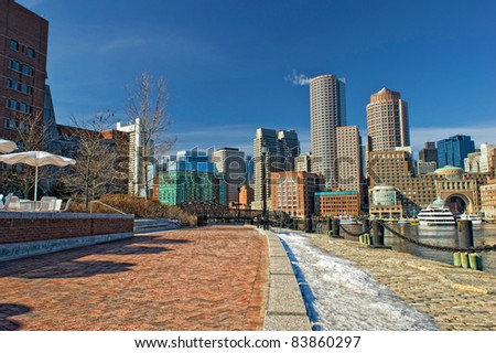 View of Boston skyline and rowe\'s wharf with skyscraper buildings during winter
