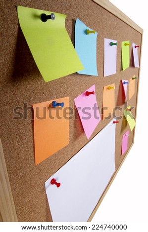 Cork office notice board with blank colorful sticker notes macro shot background