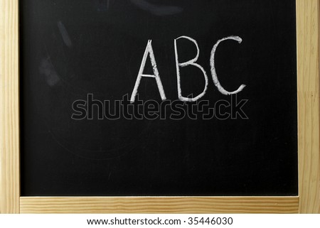 ABC letters on the fragment of the blackboard