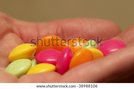 Colored glossy rounded multi vitamin pills macro shot