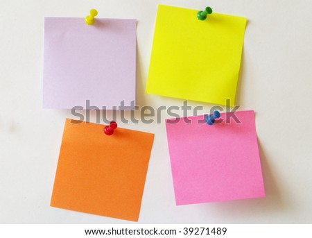 Color sticker notes over white paper background
