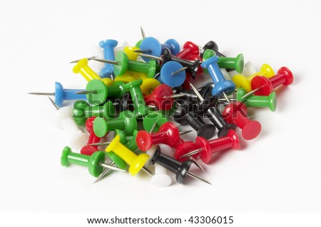 Pile of colored push pins isolated over white background
