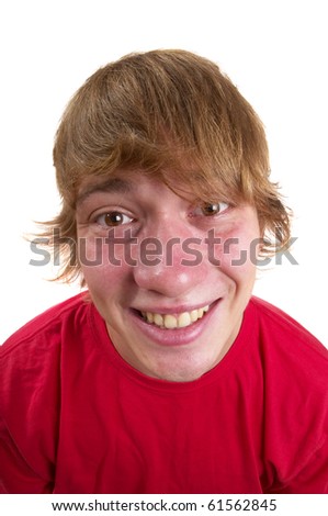 Young happy teenager portrait isolated over white background (wide angle lens shot)