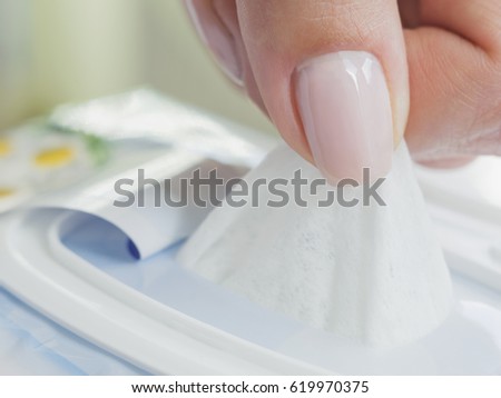 Baby wet wipes in a woman\'s hand.
