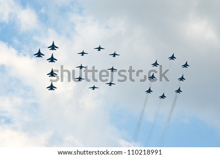 ZHUKOVSKY, RUSSIA - AUGUST 12: different military jets form number 100 during the celebration of the centenary of Russian Air Force on August 12, 2012 in Zhukovsky, Russia