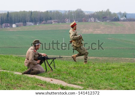 LOSHANY, BELARUS - MAY 5: two military history club members in Imperial Japanese Army uniform attack during historical reenacting show at Stalin\'s Line memorial on May 05, 2013 in Loshany, Belarus