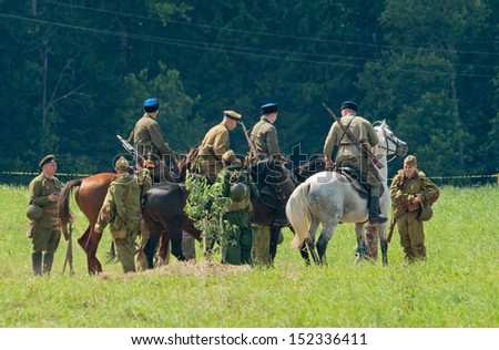DUBOSEKOVO, RUSSIA - JULY 13: military history club members reenact a Red Army cavalry patrol during Field of Battle military history festival on July 13, 2013 in Dubosekovo, Russia