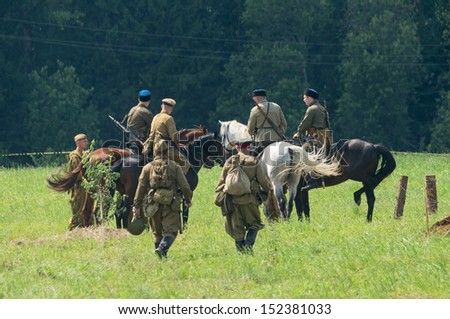 DUBOSEKOVO, RUSSIA - JULY 13: military history club members reenact a Red Army cavalry patrol during Field of Battle military history festival on July 13, 2013 in Dubosekovo, Russia