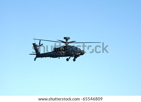 DUXFORD, UK - OCTOBER 10:  AH-64D Apache Longbow attack helicopter flies during Autumn Air Show on October 10, 2010 in Duxford, UK