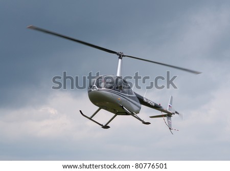 TVER, RUSSIA - JULY 09: Robinson R-44 helicopter hovers during the Tver Blue Skies aviation festival on July 09, 2011 in Tver, Russia