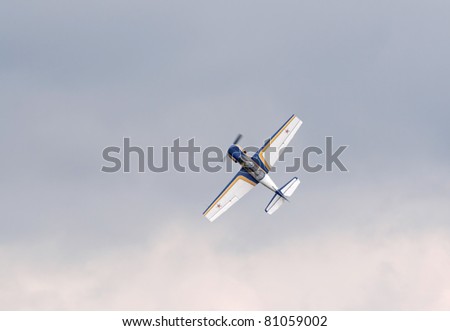 TVER, RUSSIA - JULY 09: Yak-52 plane demonstrates aerobatics during the Tver Blue Skies aviation festival on July 09, 2011 in Tver, Russia