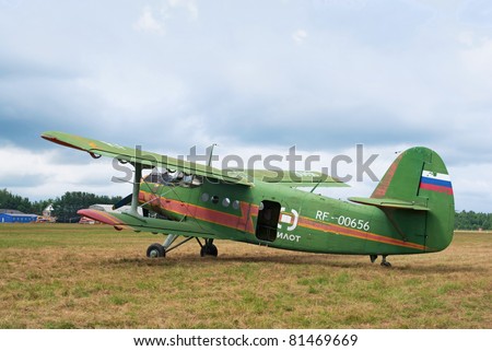 TVER, RUSSIA - JULY 09: Antonov An-2 multipurpose biplane stands in the field during the Tver Blue Skies aviation festival on July 09, 2011 in Tver, Russia