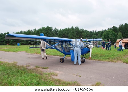 TVER, RUSSIA - JULY 09: Pilot checks engine of the Aeroprakt-22L ultralight airplane during Tver Blue Skies aviation festival on July 09, 2011 in Tver, Russia