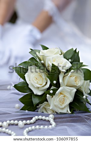 wedding bouquet against bride silhouette
