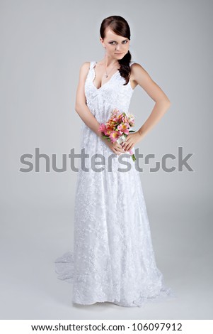 Beautiful bride in wedding dress in studio shooting