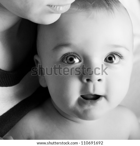 Black-white image of mother with baby