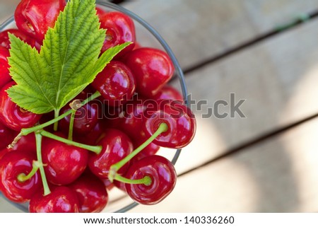 Sweet cherry fruits in bowl outdoor