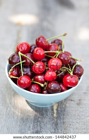 Sweet cherry fruits in bowl outdoor