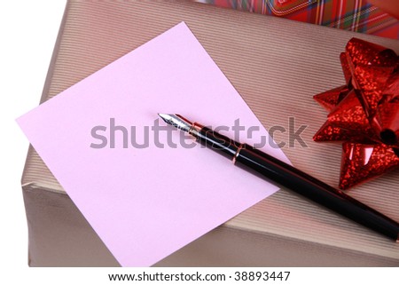 Pen and note paper to rest upon gift