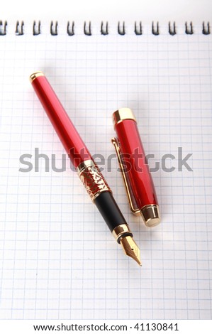 Red fountain-pen and note pad
