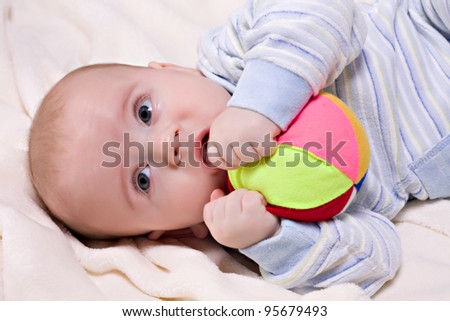 Little baby boy with teething toy