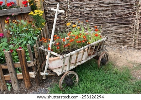Flower decoration in a wooden cart
