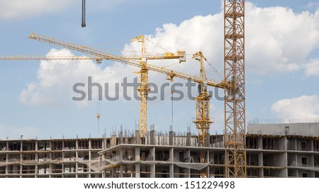 Cranes on a construction site. Industrial image