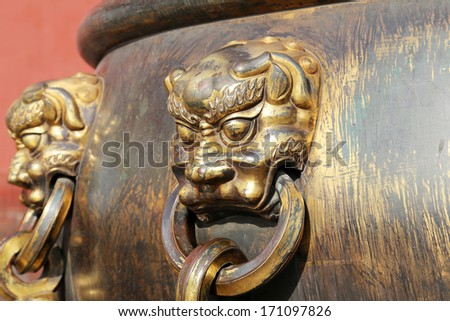 Large bronze bowl to extinguish fire with image Chinese dragon statue in the Forbidden City. Beijing, China