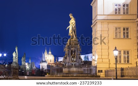 Night view of statue on the Charles Bridge in Prague, Czech Republic