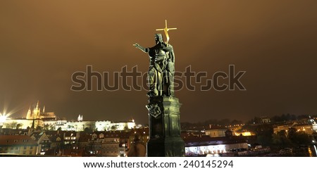 PRAGUE, CZECH REPUBLIC-  NOVEMBER 13, 2014: Night view of statue on the Charles Bridge in Prague, Czech Republic