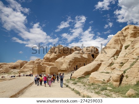 PETRA, JORDAN- APRIL 09, 2014: The 1.2km long path (As-Siq)  to the city of Petra, Jordan-- it is a symbol of Jordan, as well as Jordan\'s most-visited tourist attraction.