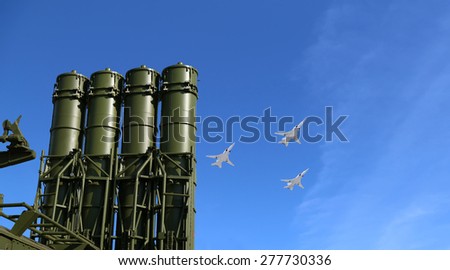 Modern Russian anti-aircraft missiles and military aircrafts fly in formation against the sky