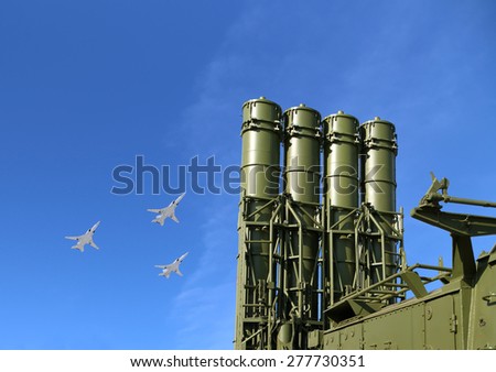 Modern Russian anti-aircraft missiles and military aircrafts fly in formation against the sky