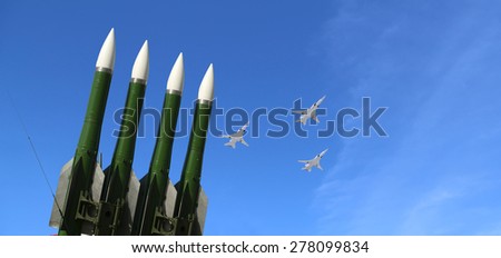 MOSCOW, RUSSIA - MAY, 07 2015: Modern Russian anti-aircraft missiles and military aircrafts fly in formation against the sky