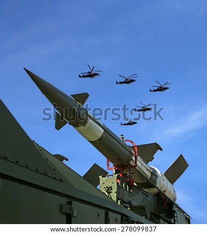 MOSCOW, RUSSIA - MAY, 07 2015: Modern Russian anti-aircraft missiles and military aircrafts fly in formation against the sky