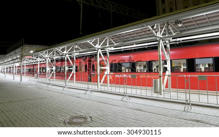 MOSCOW, RUSSIA - AUGUST, 08 2015:Train on Moscow passenger platform at night (Belorussky railway station) in Moscow, Russia. On a train inscription \