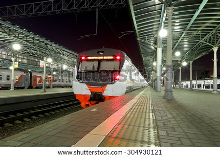 MOSCOW, RUSSIA - AUGUST, 08 2015:Train on Moscow passenger platform at night (Belorussky railway station)  in Moscow, Russia. Inscribed on the train \