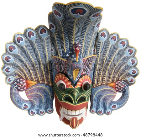 Traditional Indonesian (Balinese) mask-souvenir from a tree isolated on white background