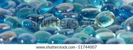 Background of brilliant blue glass stones, close-up