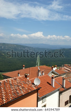 view of the house with red roofs and the valley from a high point. The town of Motovun, Croatia