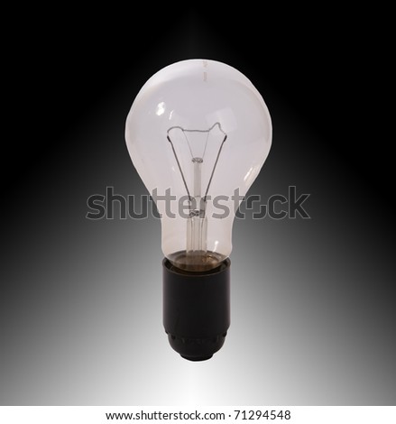 Large brushed electric incandescent lamp, against a dark and white background
