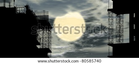 Silhouette of construction, construction equipment and elements of the building under construction on the sky background