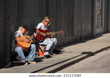 ST. AUGUSTINE, FL - APRIL 12: Street musicians play for passersby in the old colonial district April 12, 2014 in St. Augustine, FL.