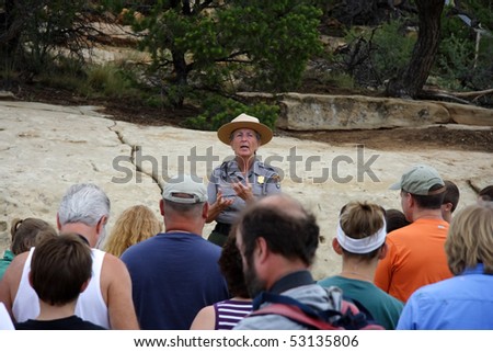 MESA VERDE, CO - JULY 26: A Park Ranger gives visitors a pep talk before leading them down to the awe-inspiring ruins of Cliff Palace July 26, 2008 in Mesa Verde, CO.