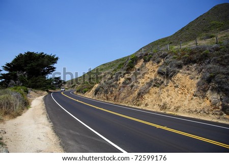 The Pacific Coast Highway winds along California\'s coastal mountains