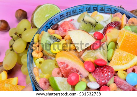 cereal with fruit on pink wooden table
