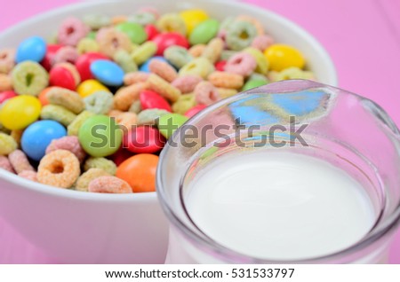 cereal with candy on pink wooden table