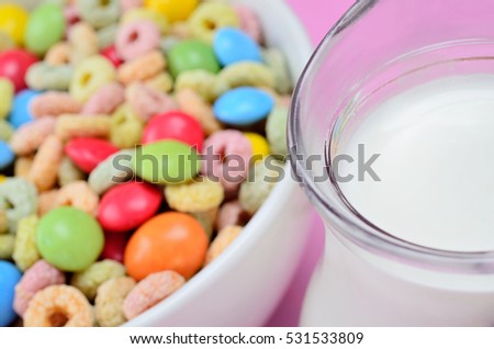 cereal with candy on pink wooden table
