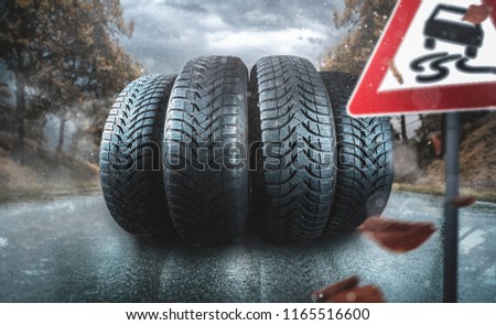 Car tire on an autumn road